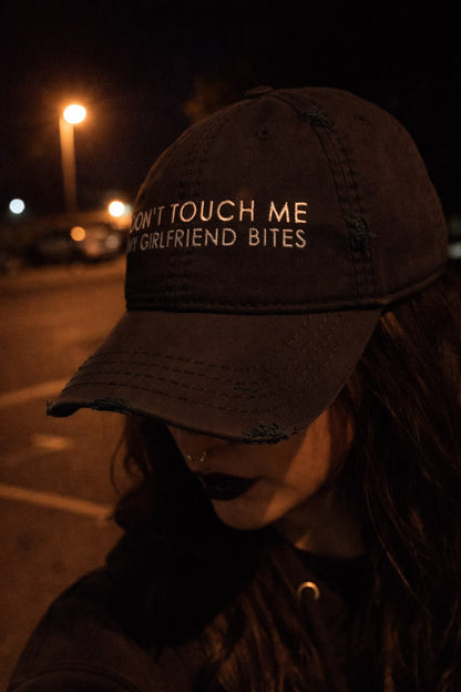 Don't Touch Me My Girlfriend Bites Distressed Dad Hat
