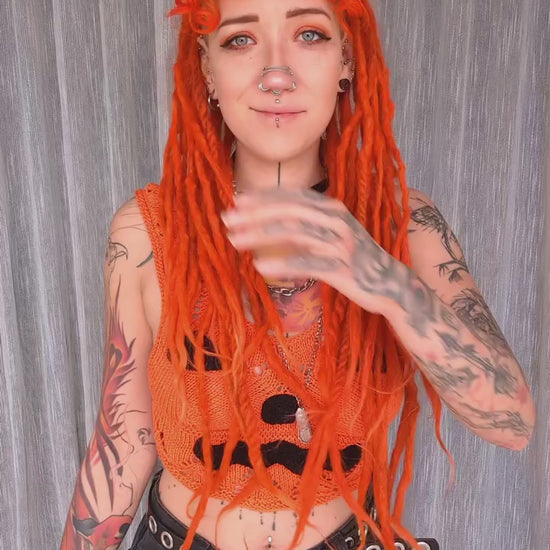 Natalia repping the orange Overstimulated Crop Top