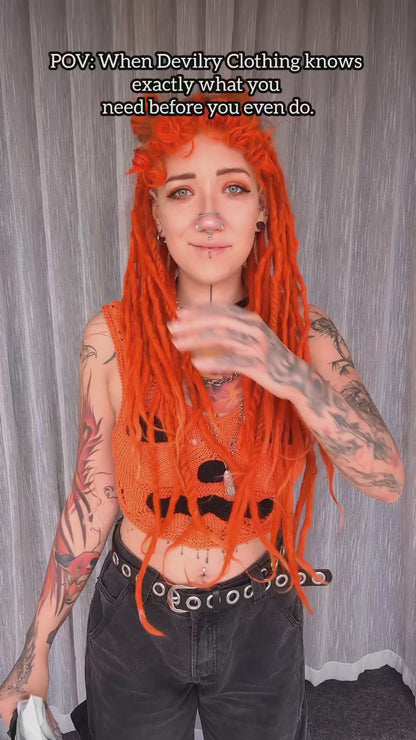 Natalia repping the orange Overstimulated Crop Top