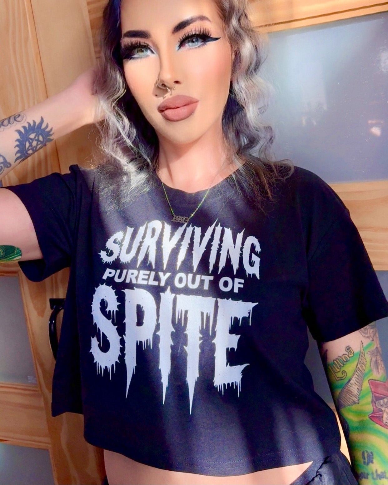 Surviving Purely Out of Spite Crop Top
